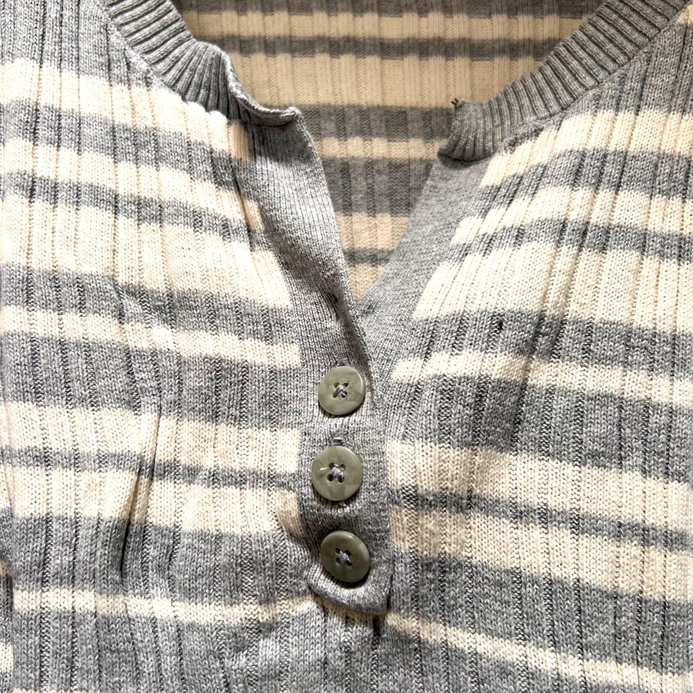 Comfy sweater, yet sexy. Three buttons in the front.